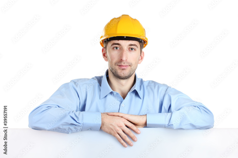 Young man architect with helmet isolated on white Young man architect with helmet isolated on white