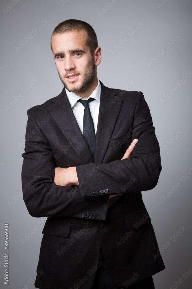 Fototapeta premium successful young business man on gray background