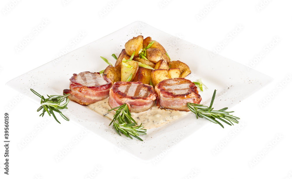 Grilled steak wrapped in bacon, with grilled vegetables