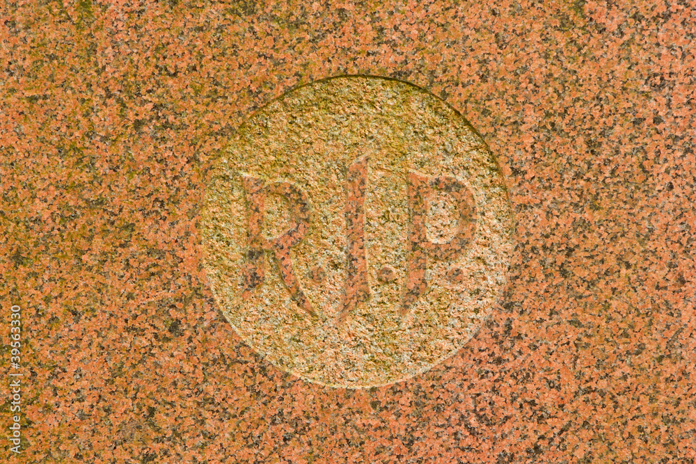 The letter RIP on a grave