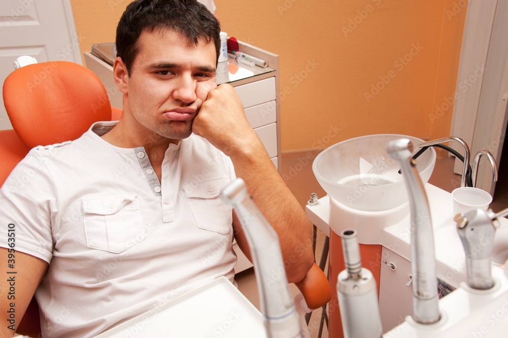 Sad patient at a dentist's surgery. Sad patient at a dentist's surgery.