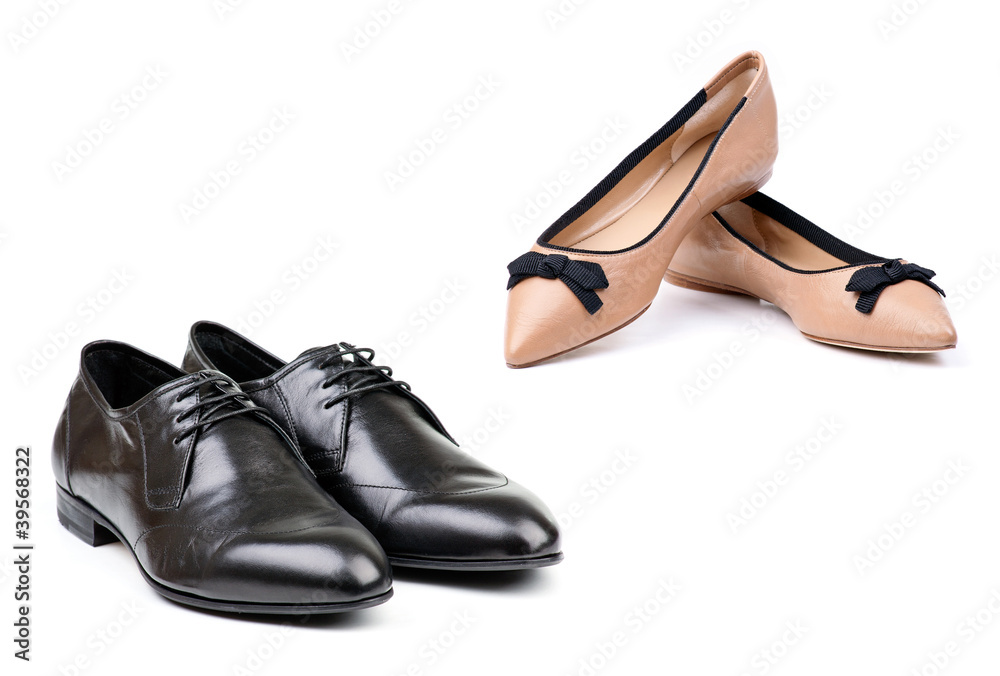 Two pairs of men and women shoes over white Two pairs of men and women shoes over white