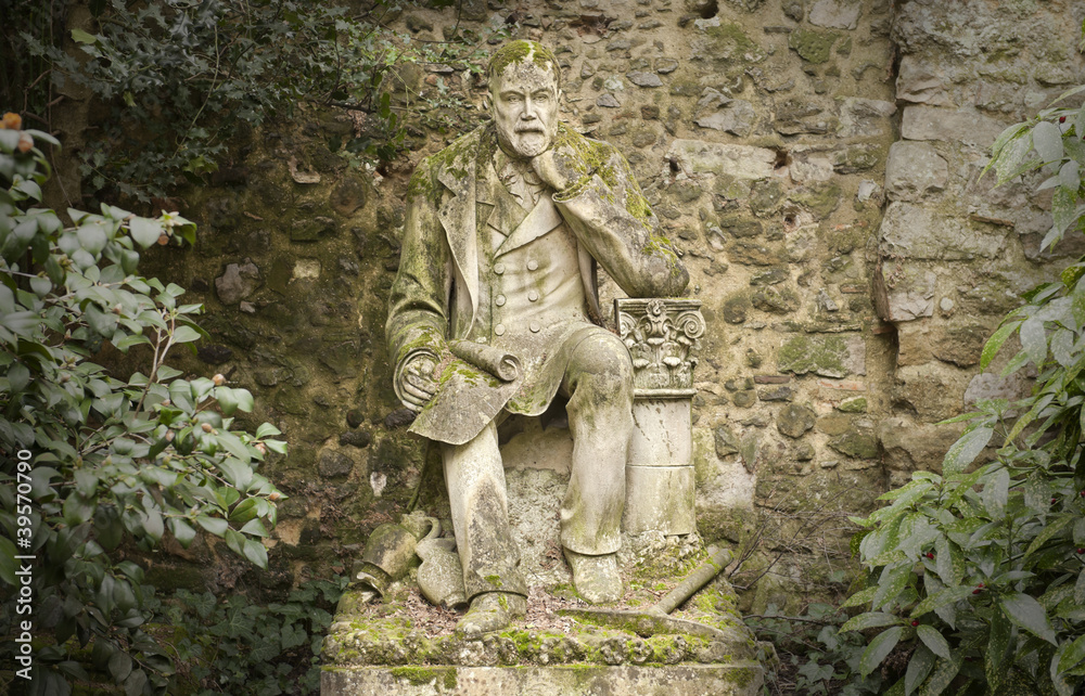 old weathered statue of a poet
