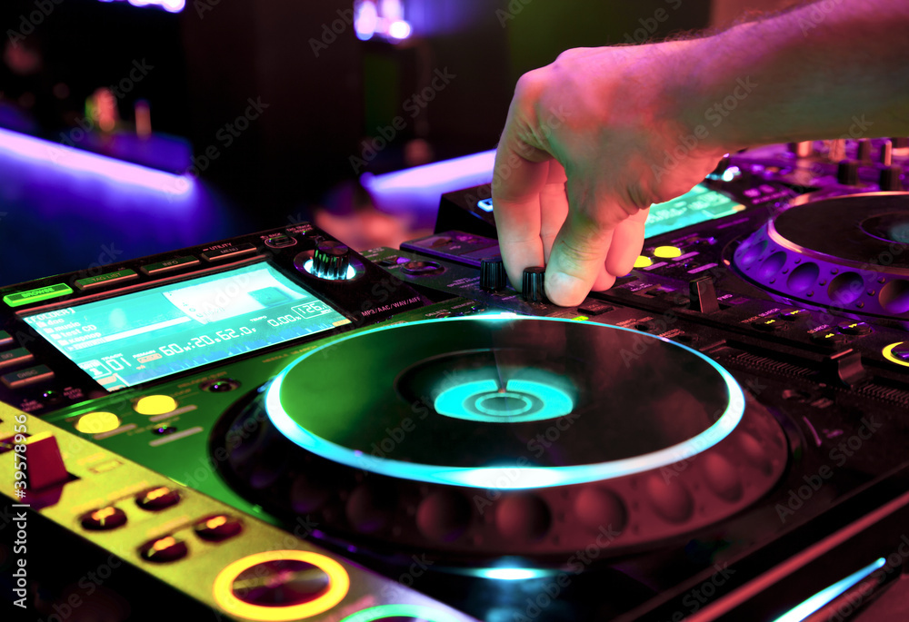 Obraz premium Dj mixes the track