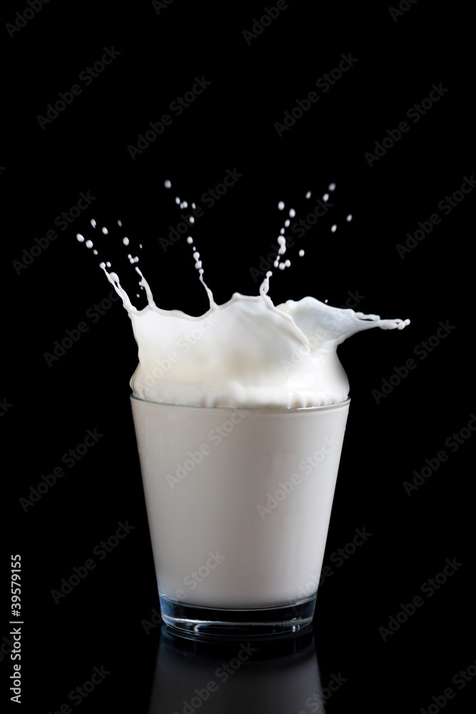Milk splashing into glass