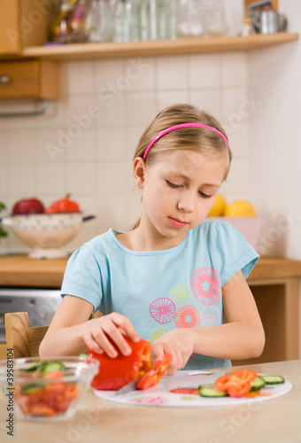 girl making salad