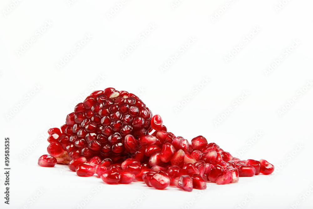 pomegranate seeds on a white background pomegranate seeds on a white background
