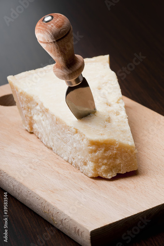 Parmesan cheese with knife
