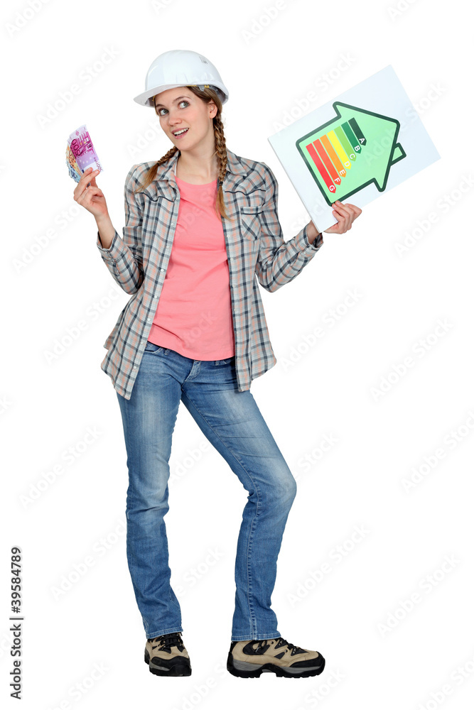 Tradeswoman holding up an energy efficiency rating chart Tradeswoman holding up an energy efficiency rating chart