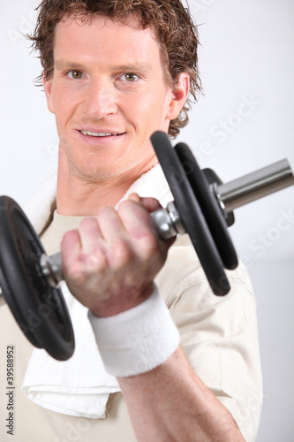 Man lifting dumbbell