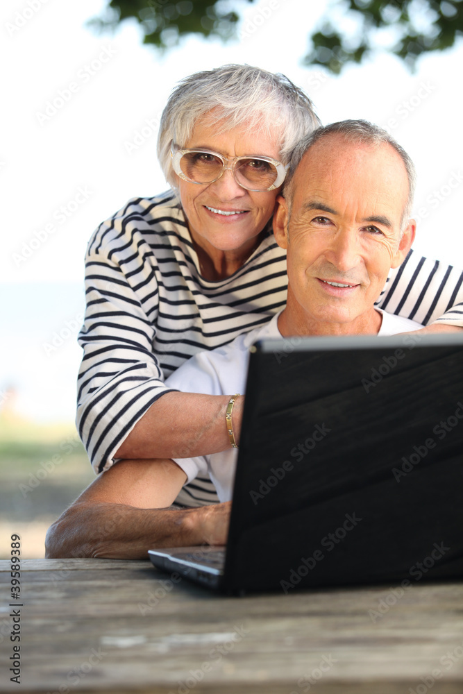 Retired couple on the computer