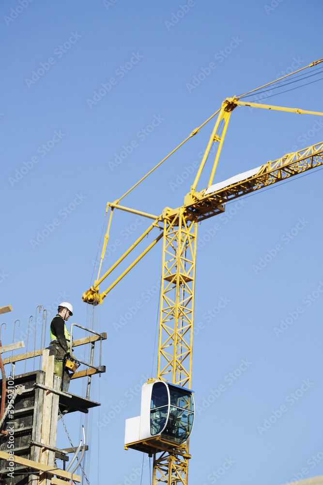 construction-crane being remote controlled construction-crane being remote controlled