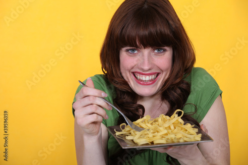Woman eating tagliatelle