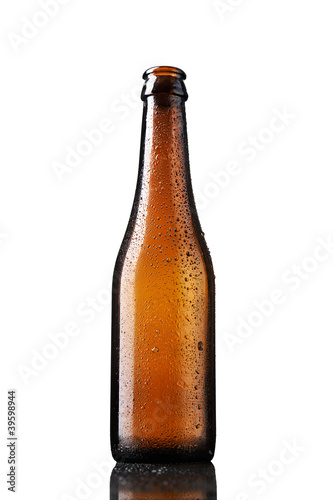 Empty bottle of beer with drops