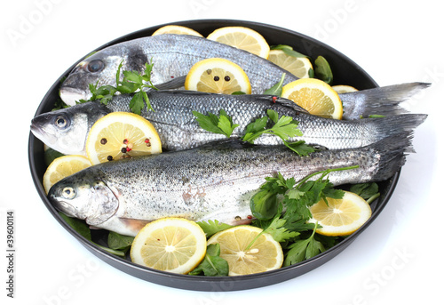Fresh fishes with lemon, parsley and pepper