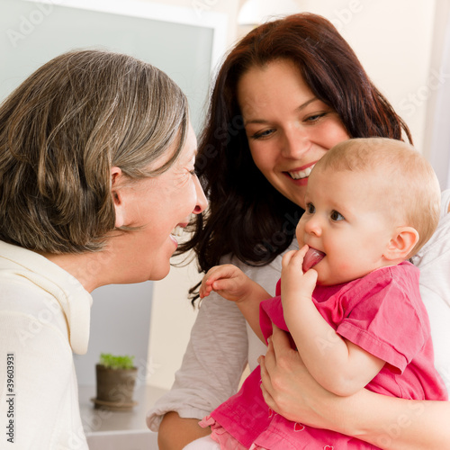 Happy family women - grandmother, mum and baby photo