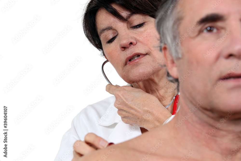 Fototapeta premium Doctor examining patient