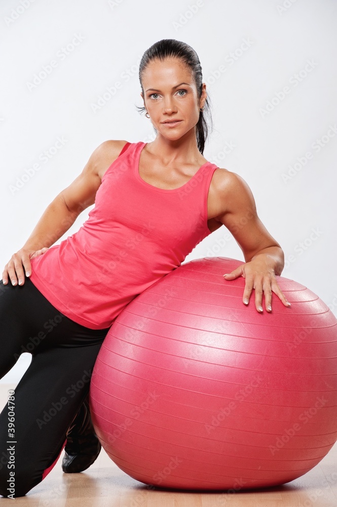 Beautiful athlete woman with a fitness ball. Beautiful athlete woman with a fitness ball.