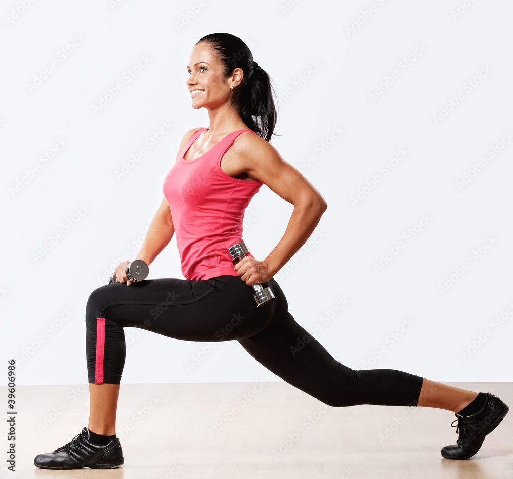 Beautiful woman doing fitness exercise with dumbbellls. Beautiful woman doing fitness exercise with dumbbellls.