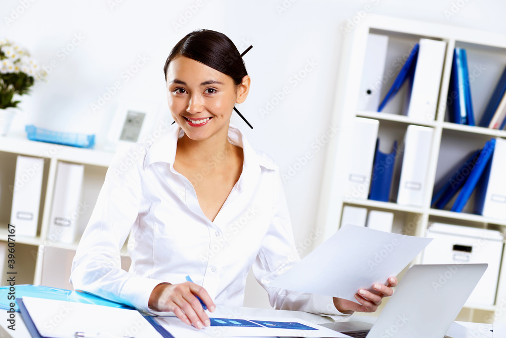 Young woman in business wear in office Young woman in business wear in office