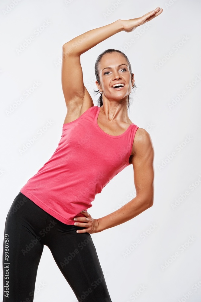 Beautiful athlete woman doing fitness exercise. Beautiful athlete woman doing fitness exercise.