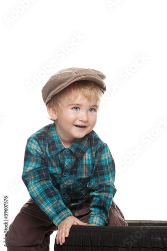 Cute funny little boy isolated on white.