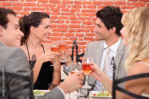 romantic foursome at restaurant photo