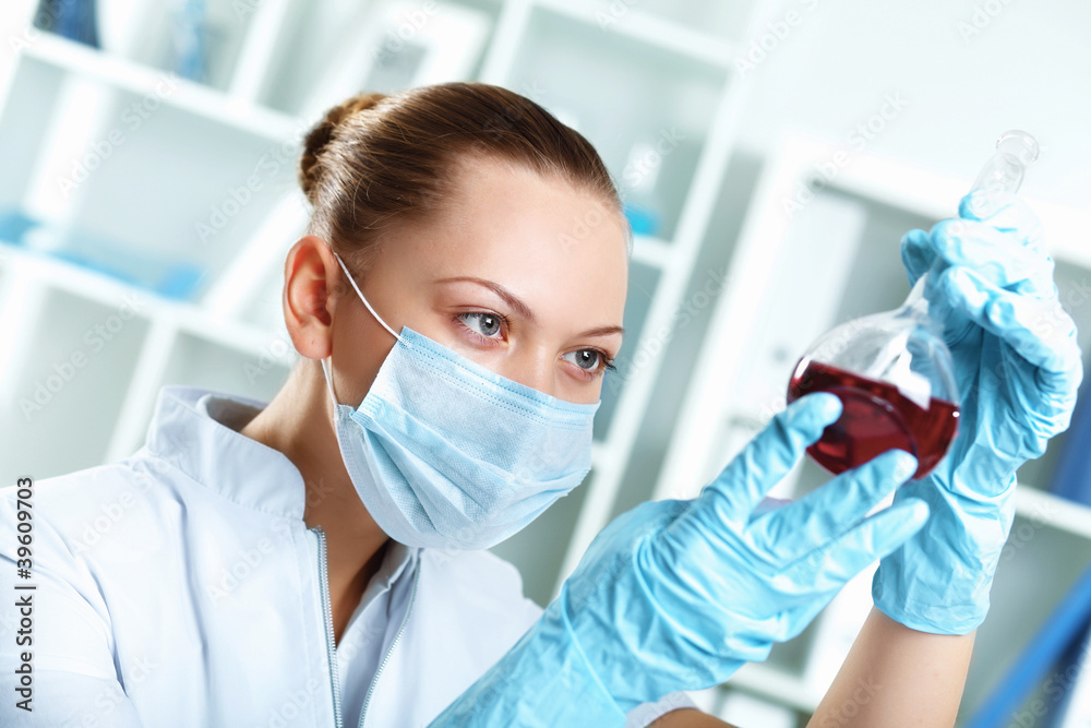 Young scientist working in laboratory Young scientist working in laboratory