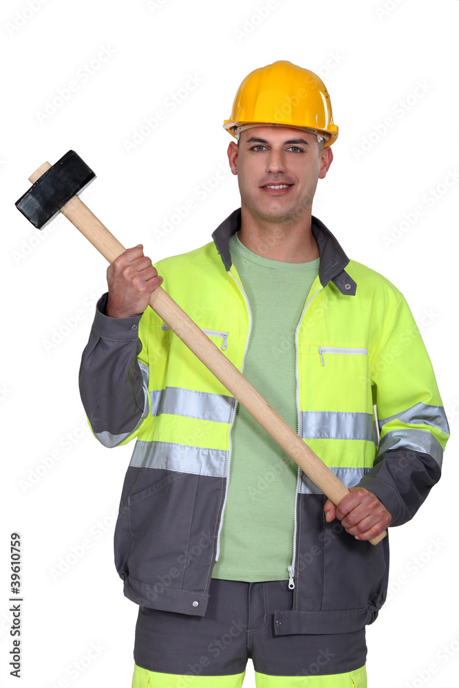 Builder holding sledge-hammer Builder holding sledge-hammer