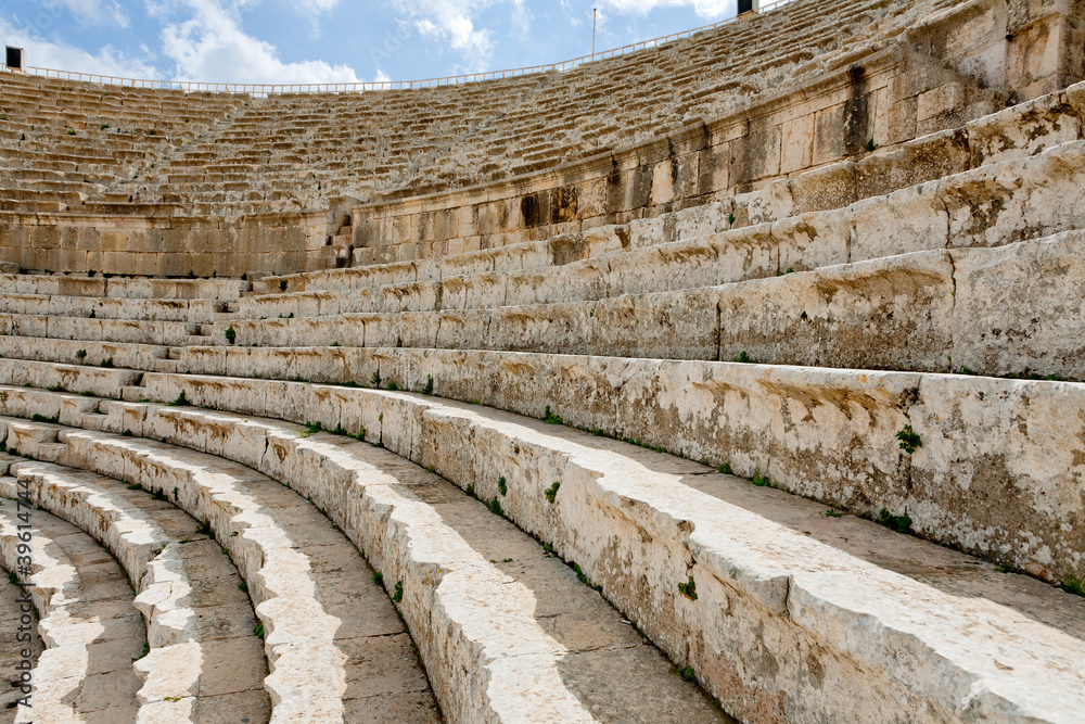 stone seats in antique Large South Theatre , Jerash