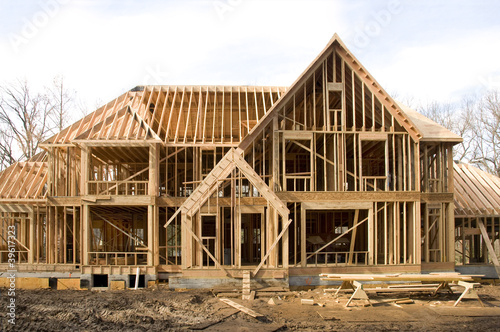 McMansion type house under construction in framing phase photo