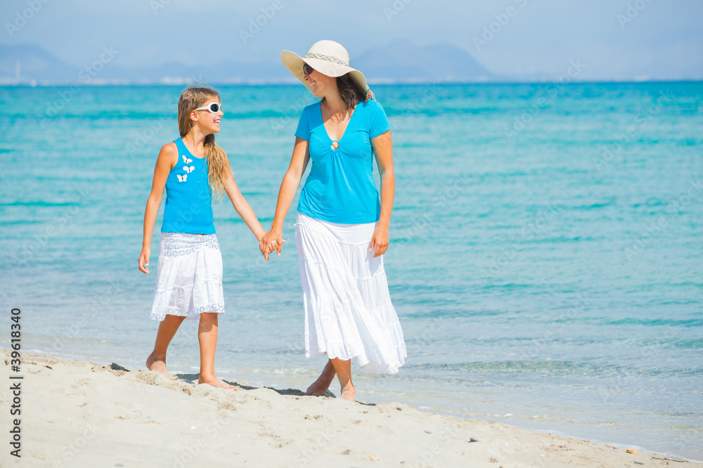 Mother and her daughter having fun on beach Mother and her daughter having fun on beach