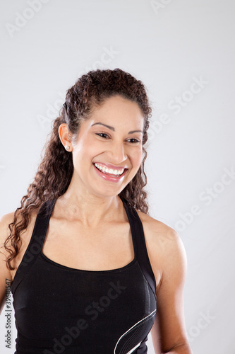 Girl in black exercise outfit  laughing