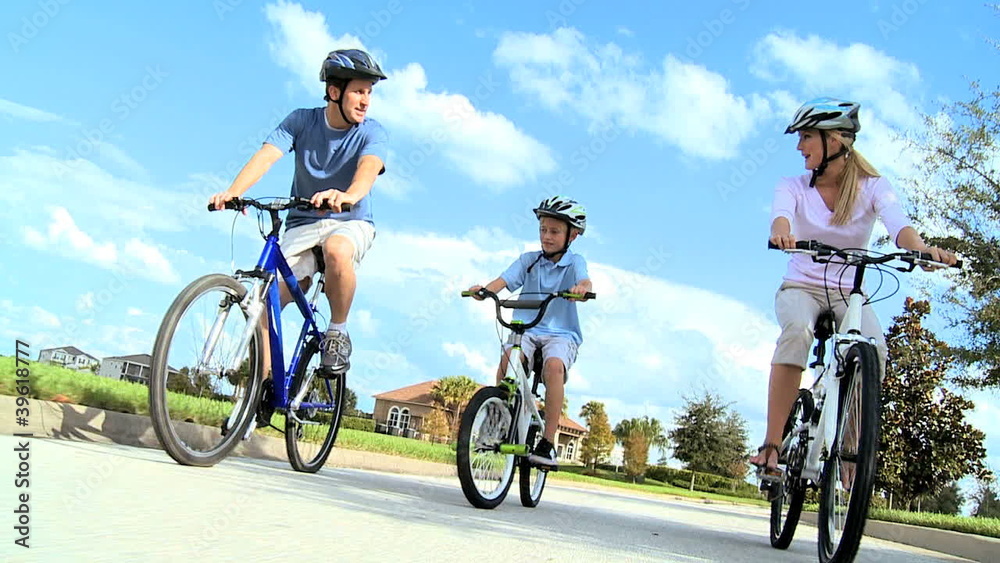 Caucasian Family Group Cycling Outdoors Caucasian Family Group Cycling Outdoors