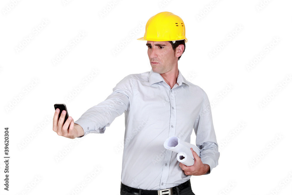 Architect looking at his cellphone