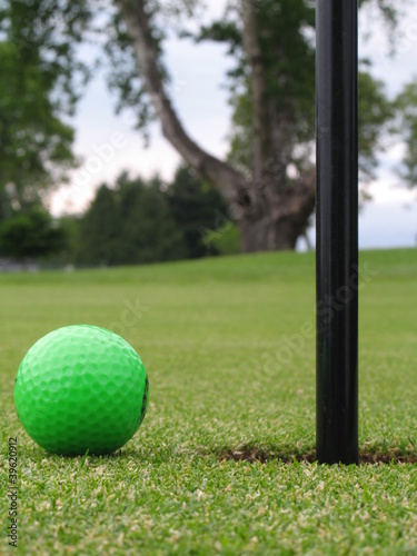 green golf ball on green