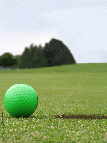 green golf ball on green