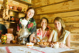 Women near  russian samovar