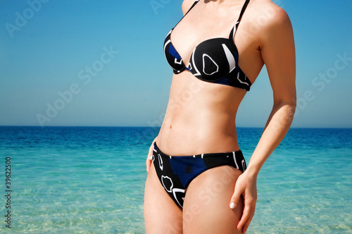 torso of a girl in a bathing suit