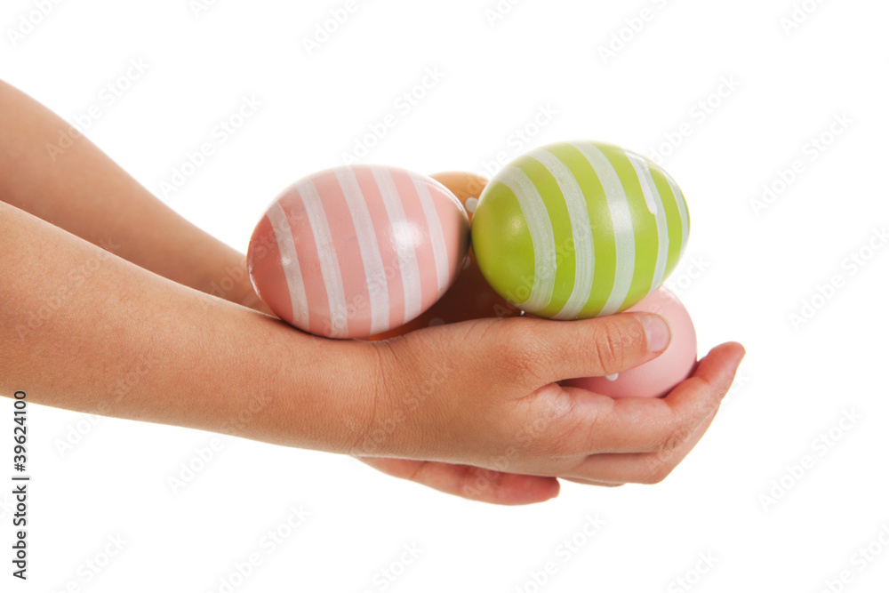 Obraz premium Child hands with easter eggs
