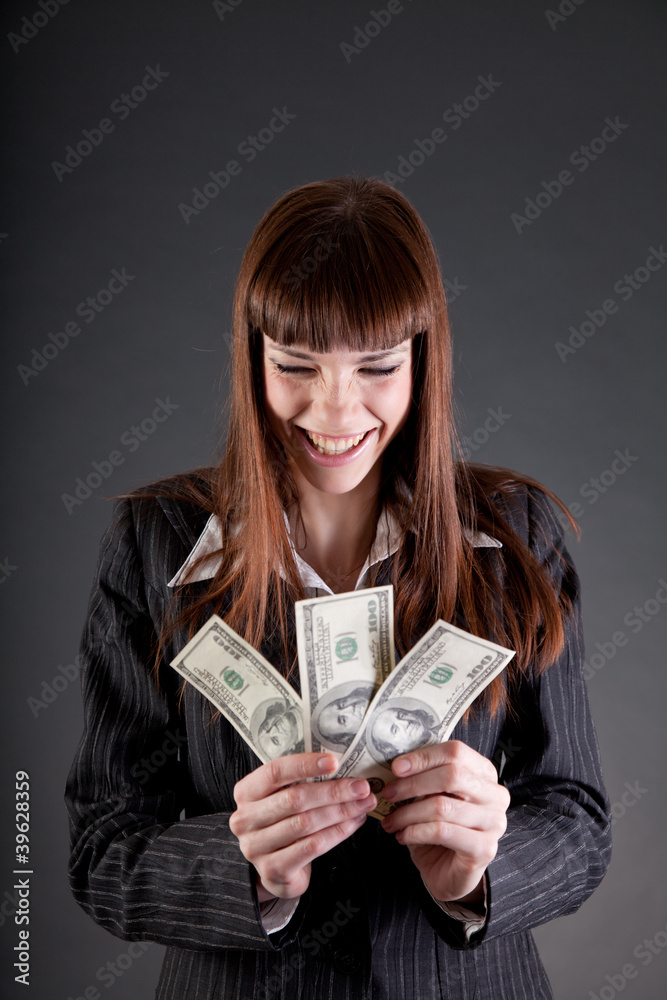 Laughing business woman with dollars Laughing business woman with dollars