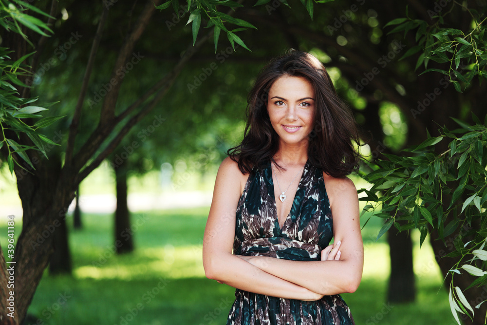 girl on a background of green trees girl on a background of green trees