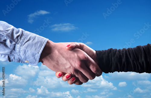 close up shot of handshake of a woman and a man © jokerpro