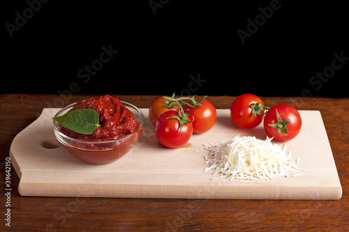 Tomato paste, cheese and some tomatoes