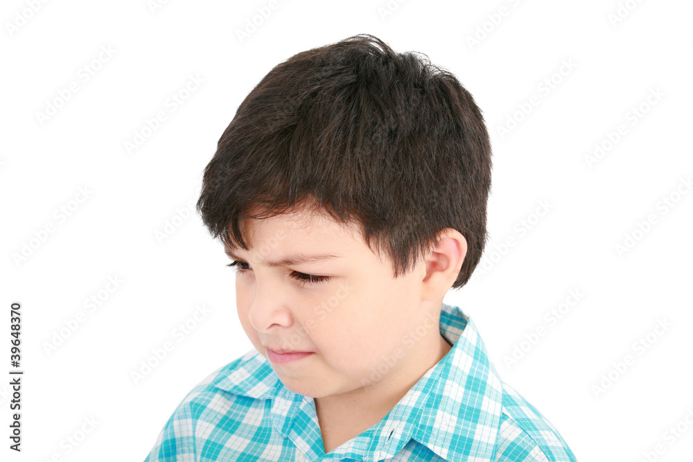 Adorable small boy looking at the viewer in a pensive mood. Adorable small boy looking at the viewer in a pensive mood.