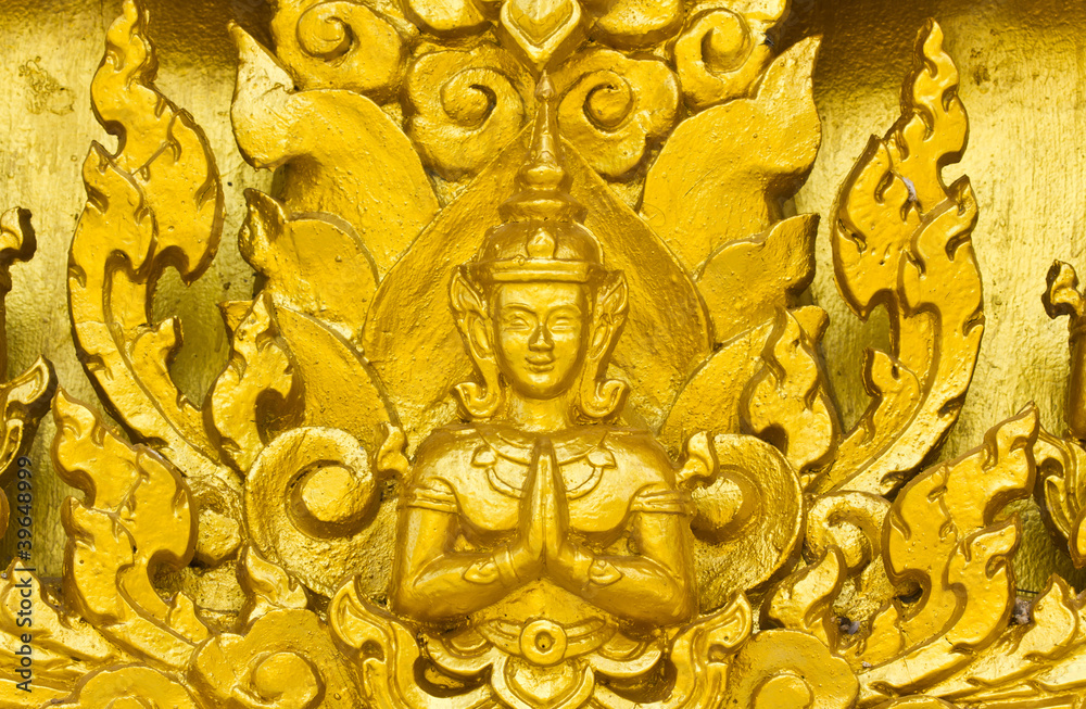 Golden angel stucco decorated on wall