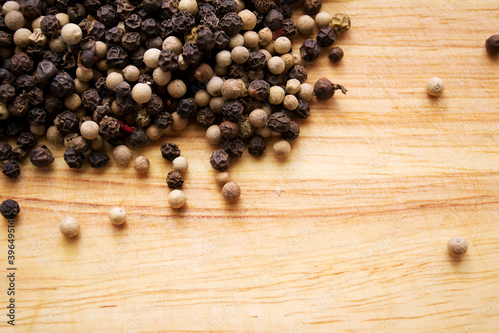 pepper on a wooden table pepper on a wooden table