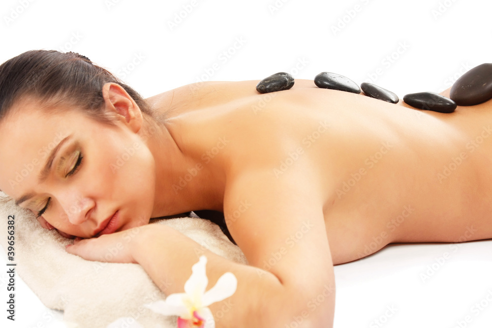 Attractive woman getting spa treatment isolated on white Attractive woman getting spa treatment isolated on white