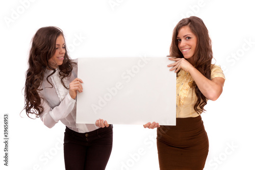 Gemini sisters hold a poster on a white background