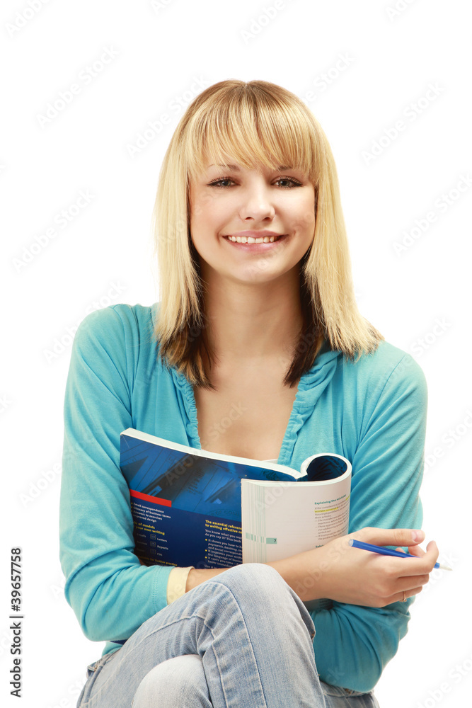 A pensive college girl with a pen and a textbook